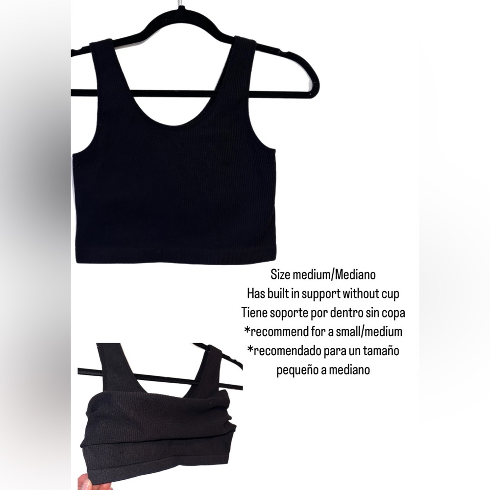 Size medium cropped top. Has built in bra without cups.